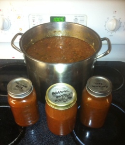 sauce on stove and in jars
